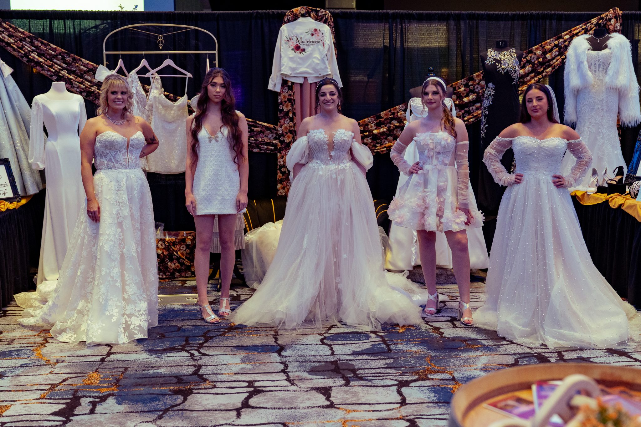 Models in wedding gowns for a bridal expo