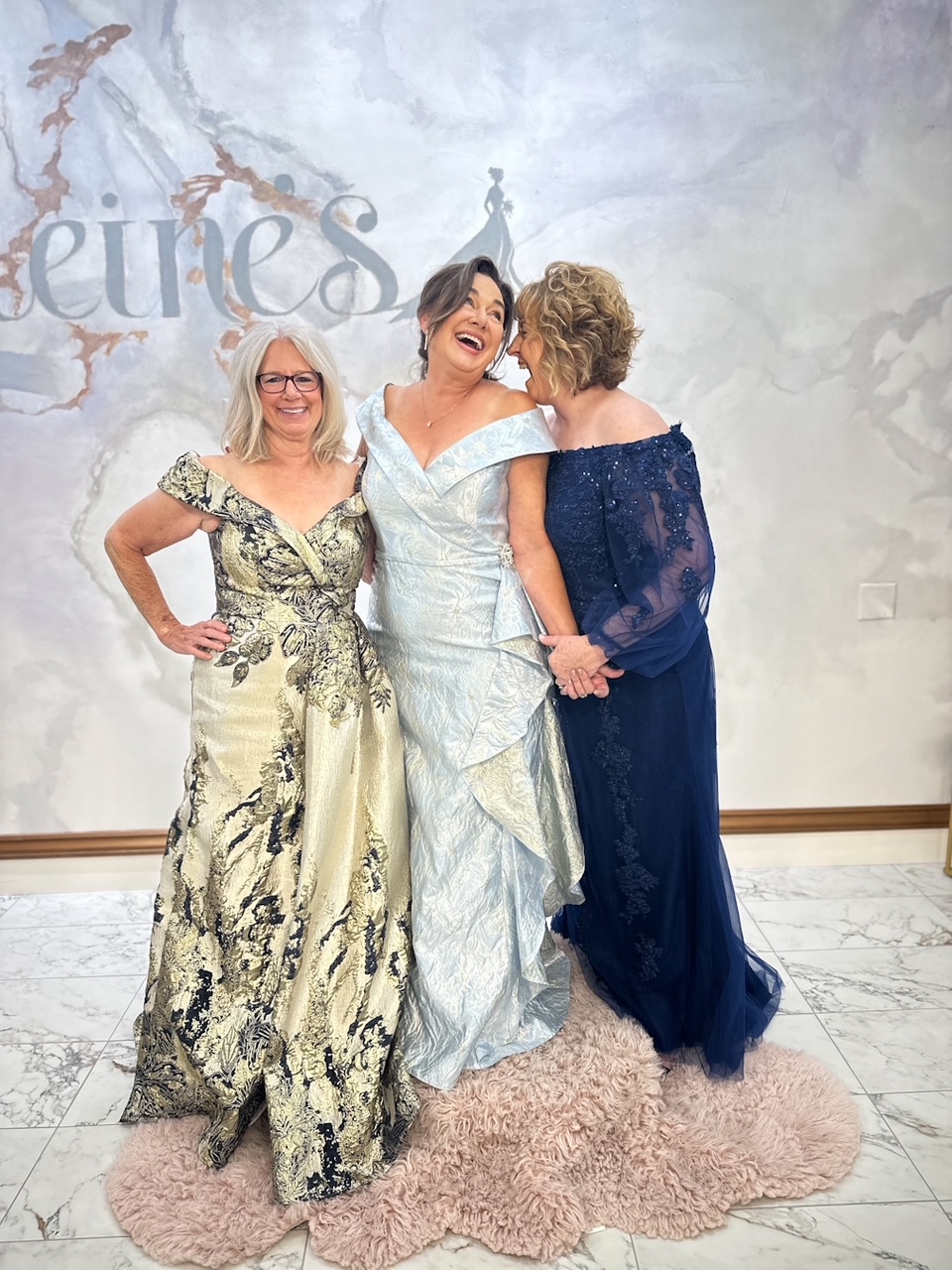 Three moms at the boutique being cheerful on their appointment