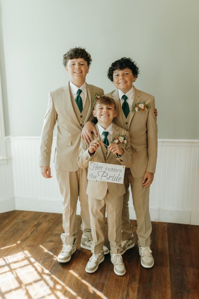 3 young boys dressed in formal attire